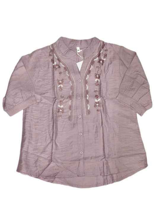 Elegant Maruti Western Wear fancy top with intricate designs displayed on a mannequin against a neutral background.